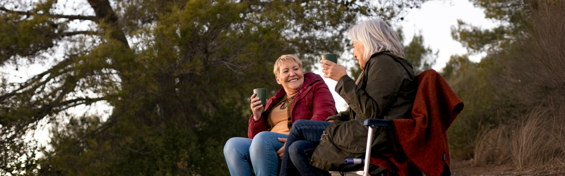 two friends having coffee on hike